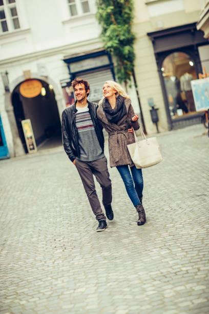 istock Happy couple in love walking embraced 1069639324