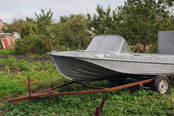 istock Old iron boat are standing in the garden on the backyard 1069643162