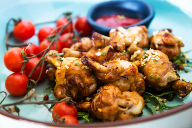istock roasted sleeves chicken with potatoes and barbecue sauce 1069643524