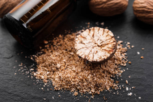 istock nutmeg essential oil on a dark stone background 1069646938