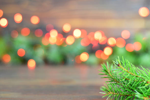 istock Christmas background with Christmas tree branches and blurred Christmas lights 1069650422