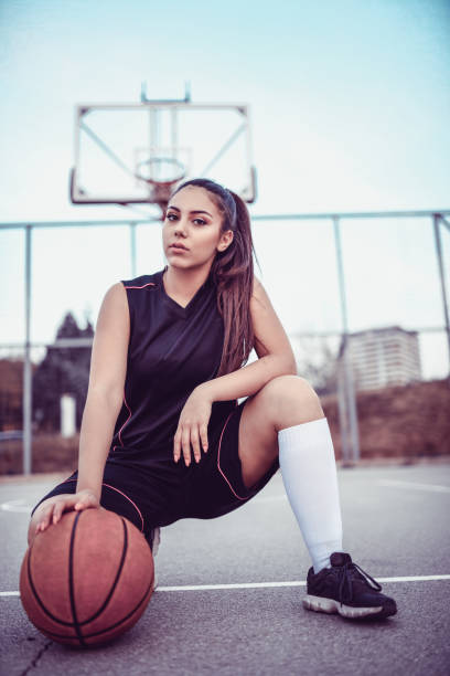 istock Cute Female Basketball Player Posing In Kneeling Position 1069650528