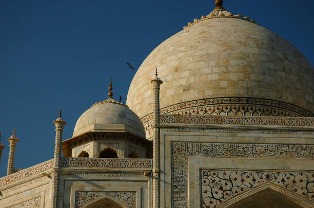 Garlic dome architecture of the Taj Mahal temple, Agra, Uttar Pradesh, India is built of white marble