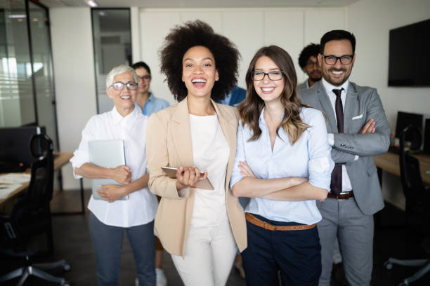 istock Group of successful business people at work in office 1069655644