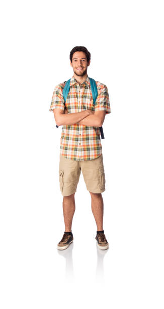 istock Male student standing with arms crossed and smiling 1069662352