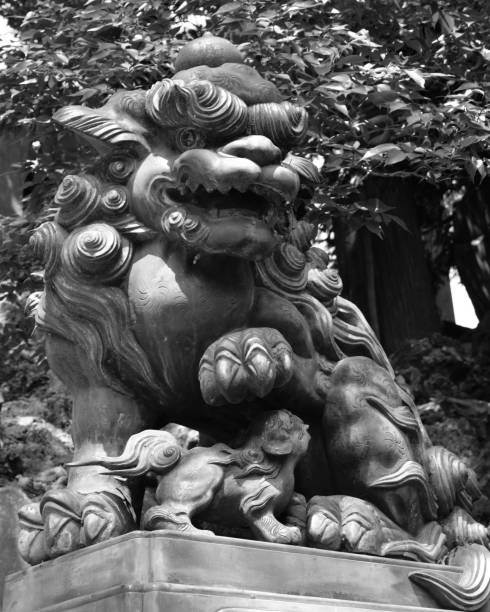 Komainu is an imaginary animal resembling a lion or a dog.It is settled to protect the temple from evil spirits.This Komainu of Naritasan Shinshoji n Chiba-ken.It is a work of the end of Edo.Narita-shi,Chiba-ken,Japan 07/31/2015