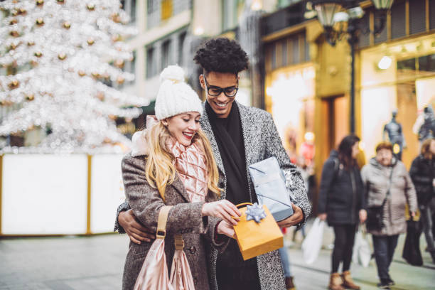 istock Young couple is buying Christmas presents 1069665414