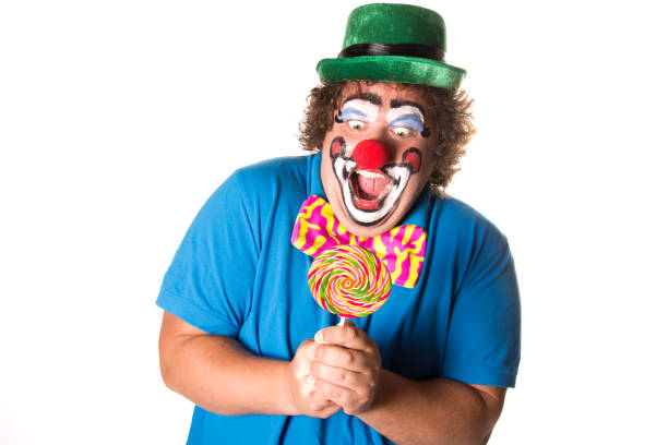 istock Funny clown. Fat man with candy. 1069665718