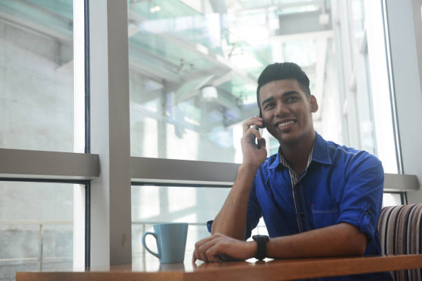 istock An Asian man using mobile phone at a cafe in Kuala Lumpur, Malaysia 1069665756