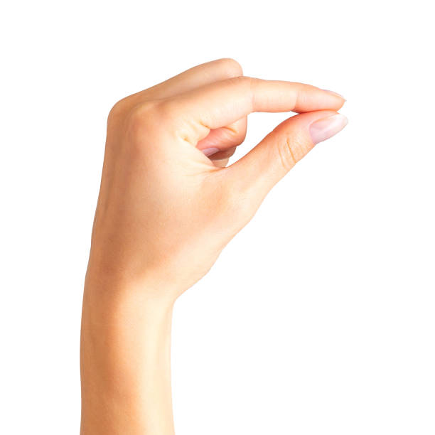 istock Woman hand holding something with two fingers 1069668048