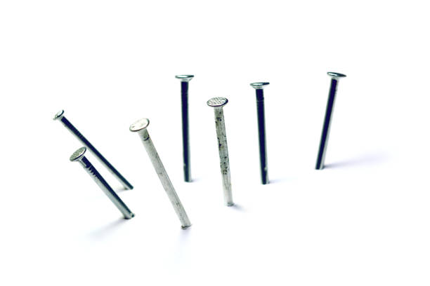 istock group of nails pegged on white  background isolated 1069668094