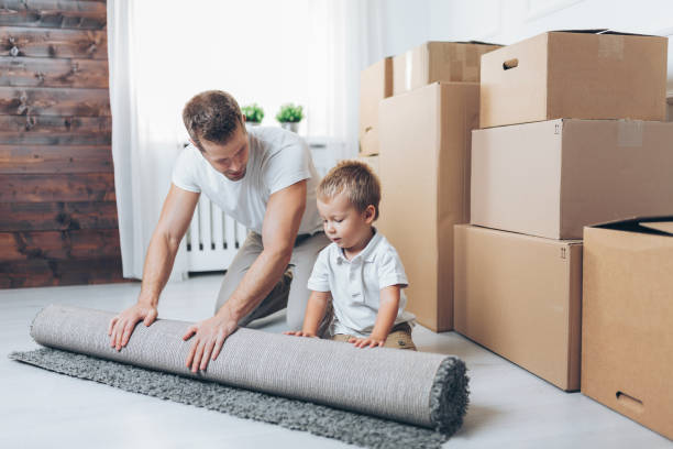 istock Moving concept, Father and son moving to a new home 1069674988