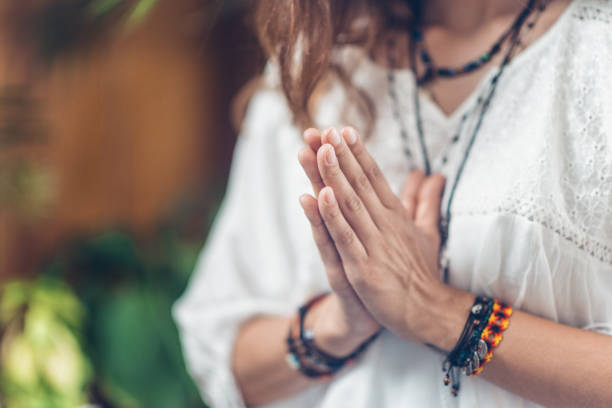 istock Yoga Woman`s Hands. Prayer position 1069675390