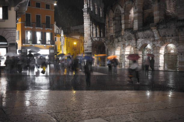 istock Old European illuminated city at rainy night 1069679730