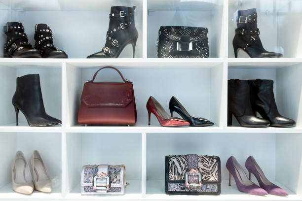 Woman Elegant High Heel Shoes in Store Display Window stock photo