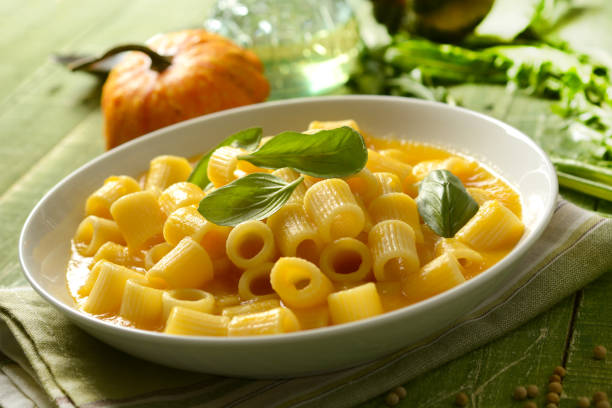 istock pumpkin soup with pasta - italian recipe - closeup 1069684362