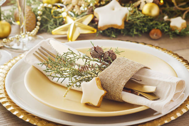istock Christmas or New Year table setting.  Place setting for Christmas Dinner. Holiday Decorations. 1069684772