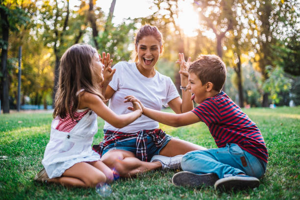 istock Dreamy soft intimate moment between a mother and her children 1069685348