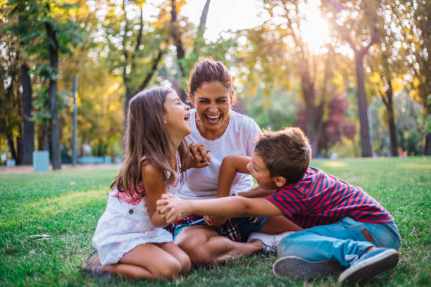istock Dreamy soft intimate moment between a mother and her children 1069685666