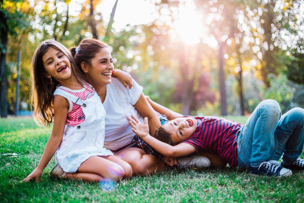 istock Dreamy soft intimate moment between a mother and her children 1069685668