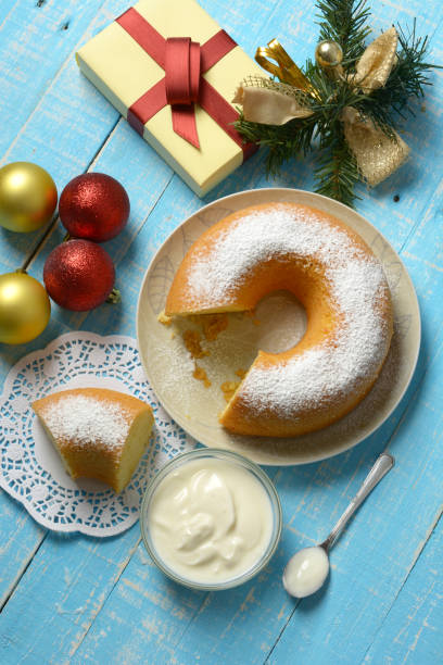 istock donut-shaped yogurt cake with Christmas decorations around - closeup 1069686134