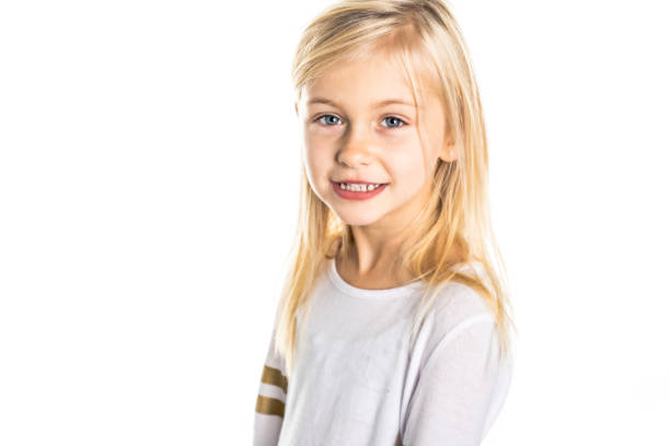 istock A Cute girl 5 year old posing in studio 1069692592