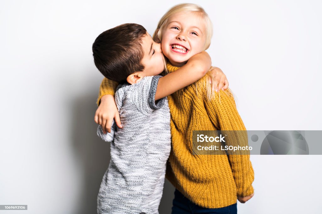The Two Caucasian siblings brother and sister posing Two Caucasian siblings brother and sister posing Child Stock Photo