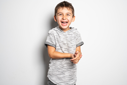A Boy having fun on studio white background