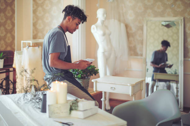 istock Hipster entrepreneur is texting to his clients 1069697248