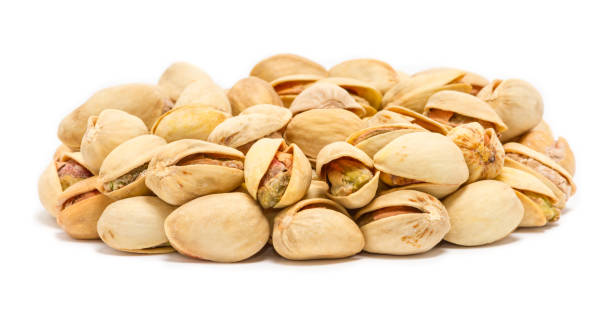istock Handful of pistachio nuts (Pistacia vera) in the shell, close up 1069699730