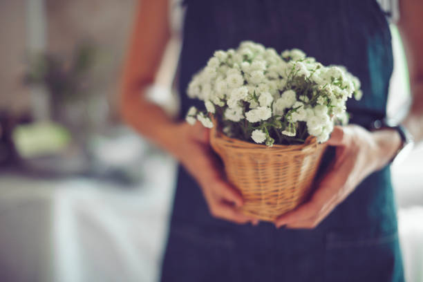 Florist is making the final touches in preparation to an event