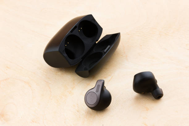 istock Wireless headphones on a wooden surface. 1069700376