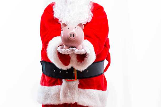 istock Santa holding a piggy bank 1069700854