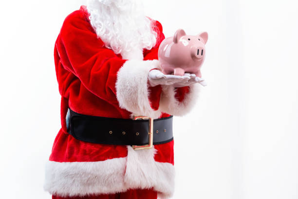 istock Santa holding a piggy bank 1069700916