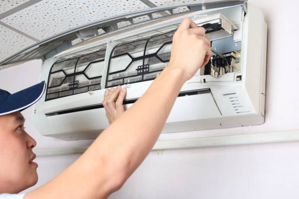 Man Repairing Air Conditioner electrolux warranty repair stock pictures, royalty-free photos & images
