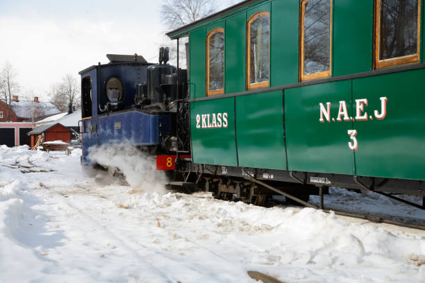 Vintage steam train Mariefred, Sweden - March 19, 2016: Oldtimer narrow gauge train during the winter season. mariefred stock pictures, royalty-free photos & images