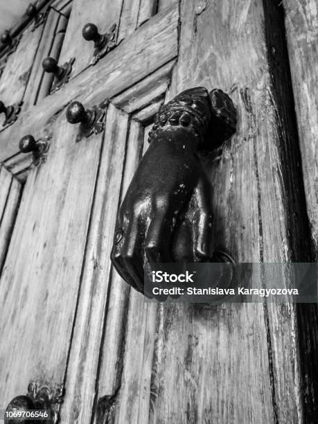 Doorknob In The Shape Of A Female Hand On A Belgian Church Door Architectural Detail Stock Photo - Download Image Now