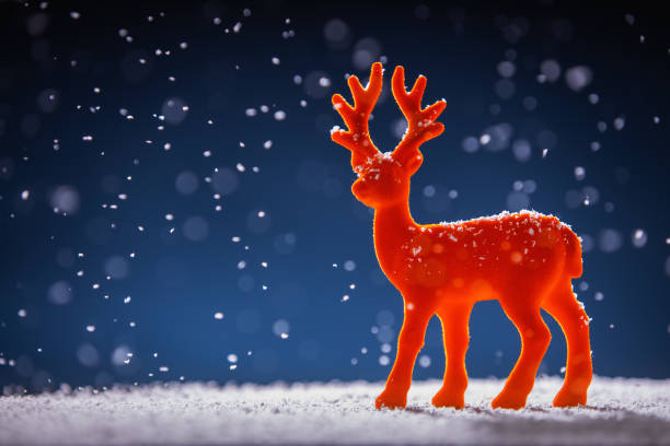 istock Christmas time background, red deer in snow, studio isolated. 1069707126