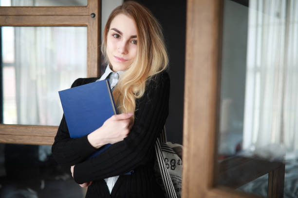istock Young pretty blonde girl student 1069708140