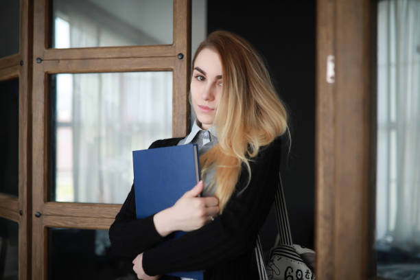 istock Young pretty blonde girl student 1069708160