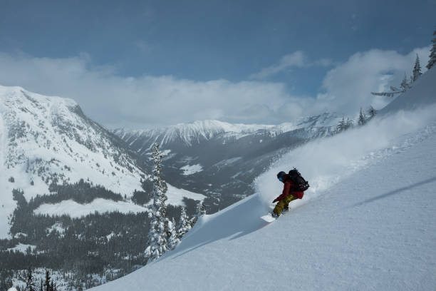 istock Backcountry snowboarding fresh lines in the mountains 1069710906