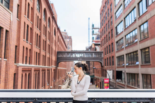 istock Portrait of business woman while using mobile 1069712470