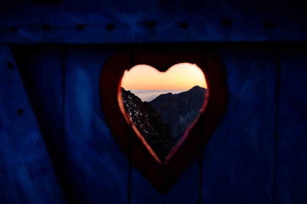 istock View on mountain landscape through door 1069713948