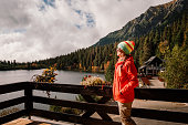 Woman relax on terrace with mountain lake view