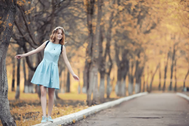 istock Young girl on a walk in the autumn 1069715332