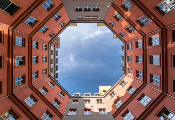 istock Directly Below Shot Of Building Against Cloudy Sky 1069719388