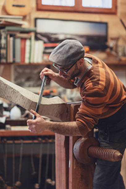 istock Carpenter working on wooden forcola for venetian gondola 1069722010