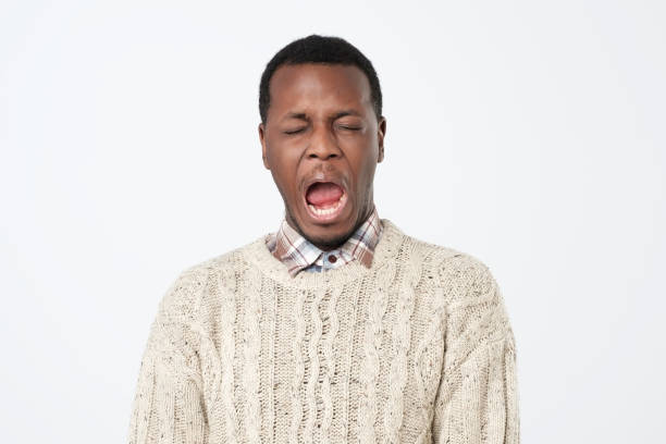 istock Black man cry out in despair and shock. 1069722408