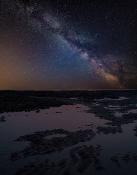 istock Vibrant Milky Way composite image over landscape of  low tide on beach 1069722876