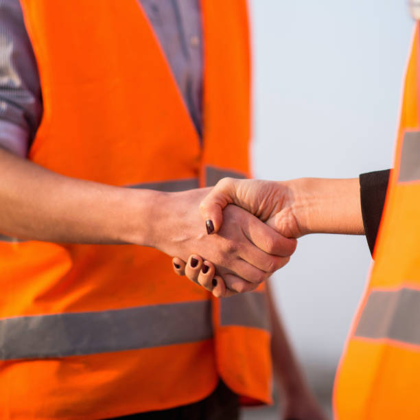 istock Close-Up Of Engineers Shaking Hands 1069723408